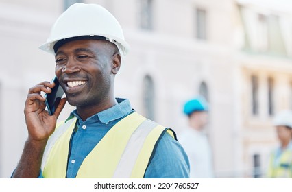 Construction Worker Using A Smartphone For Phone Call On Site. Portrait Of Happy, Smiling And Black Businessman In Safety Helmet And Safety Gear On The Phone At Job, Work And Construction Business