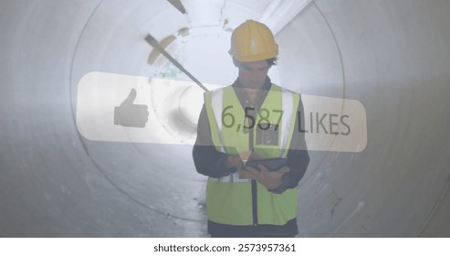 Construction worker using tablet, social media likes image over tunnel background. infrastructure, technology, digital, engineering, project, safety - Powered by Shutterstock - Get 15% off with code: PIKWIZARD15