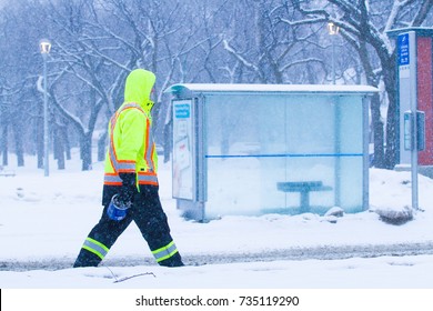 Construction Worker Walking To Job Site In Snow