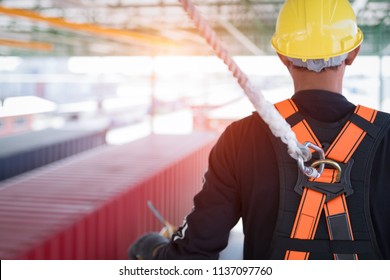 Construction Worker Wearing Safety Harness And Safety Line Working At High Place