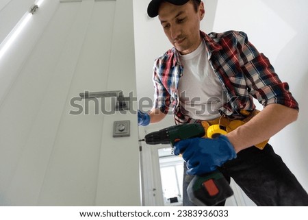 Construction Worker Working on Doorframe in House