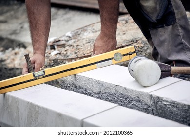 Construction Worker Working On A Street Reconstruction.