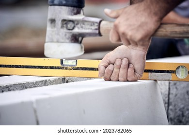 Construction Worker Working On A Street Reconstruction.