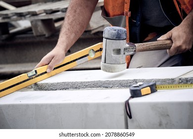 Construction Worker Working On A Street Reconstruction.