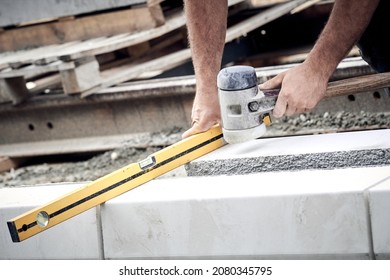 Construction Worker Working On A Street Reconstruction.