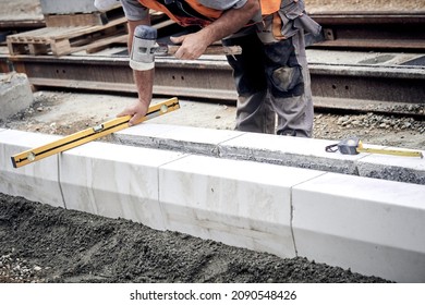 Construction Worker Working On A Street Reconstruction.