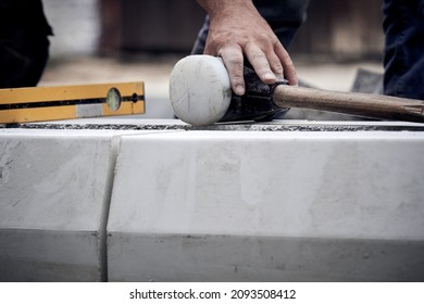 Construction Worker Working On A Street Reconstruction.