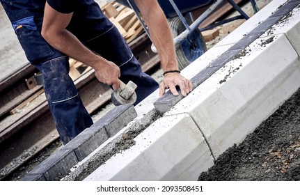 Construction Worker Working On A Street Reconstruction.