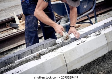 Construction Worker Working On A Street Reconstruction.