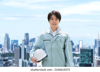 Construction workers against the backdrop of the city - Powered by Shutterstock