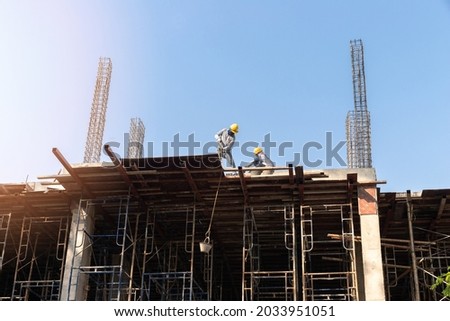 Construction workers or builder workers working on contruction site.