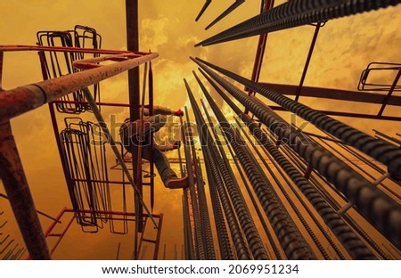 Construction workers fabricating steel reinforcement bar at the construction site.Construction labor working on the steel structure of high building. Man work deformed steel rebar structure builder.