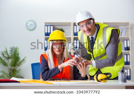 Construction workers having discussion in office before starting
