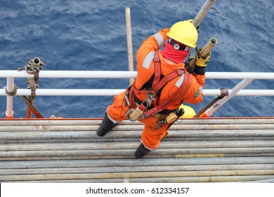 Construction Workers Installing Scaffolding On Site,Offshore Construction Platform For Production Oil And Gas, Oil And Gas Industry And Hard Work