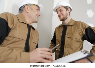 Construction Workers Laughing Together