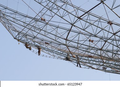 Construction workers on the Giant Meter-wave Radio Telescope `GMRT' in India. Perilous work.