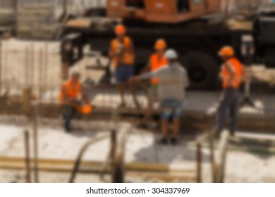 Construction, Construction Workers On Site. Blurred Background