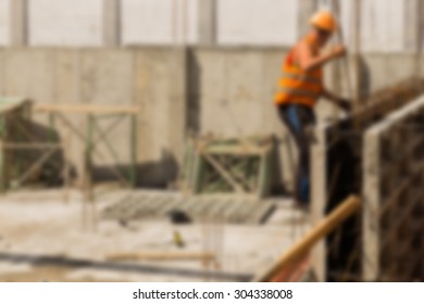 Construction, Construction Workers On Site. Blurred Background