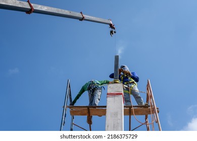 Construction Workers Put On Safety Gear To Work On The Way To Install The Factory Roof Welding Structure.