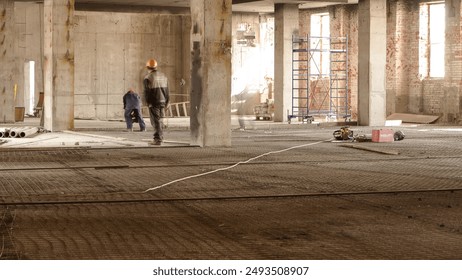 Construction workers with scaffolding and tools inside the floor of high rising building timelapse, skyscraper. Building under construction. Interior work in progress.
