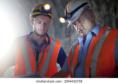 Construction Workers Talking In Tunnel