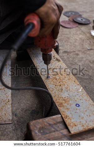 Construction workers were using a drill to create jobs.