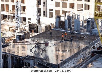 Construction workers working on Construction machine. Aerial platform for workers who work at height on buildings. 
