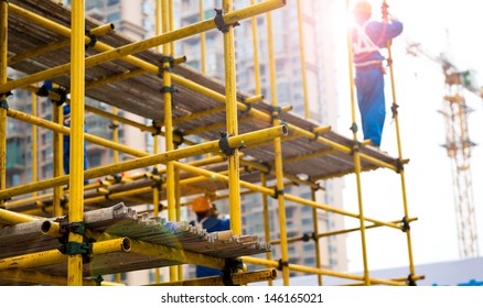 Construction Workers Working On Scaffolding Stock Photo 146165021 