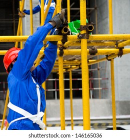 Construction Workers Working On Scaffolding Stock Photo 146165036 ...