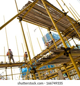 Construction workers working on scaffolding