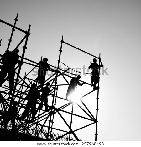 Construction workers working on scaffolding