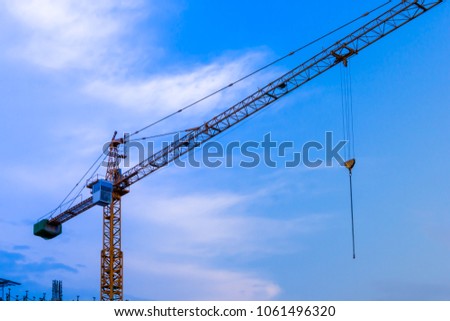 Constuction site building a tower working by crane see sky background