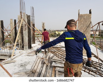 Consturction site and worker making steel 
