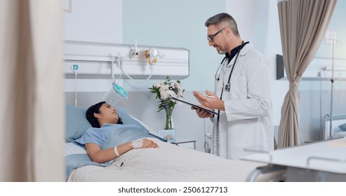 Consultation, bed and doctor with patient in hospital for healthcare, clipboard or medical service. Checklist, discussion and cardiology surgeon with woman for postoperative checkup in clinic. - Powered by Shutterstock