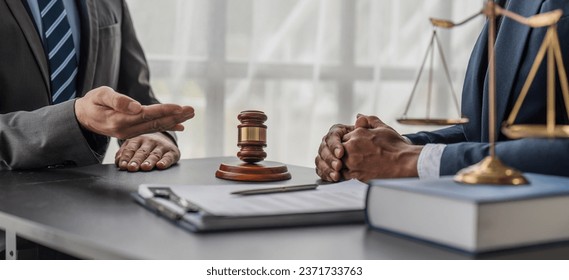 Consultation and conference of lawyers and professional businessman working and discussion having at law firm in office. Concepts of law, Judge gavel with scales of justice.