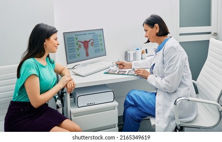 Consultation of gynecologist. Doctor and woman patient is talking in gynecological office during visit at gynecology office - Shutterstock ID 2165349619