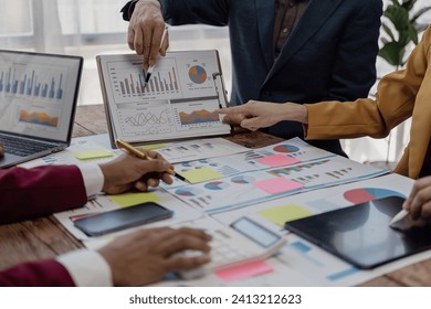 Consultation with investor colleagues and new strategic plan meeting, business and market growth report, graph, financial document, auditor team working in office Analyzing financial data, close-up - Powered by Shutterstock