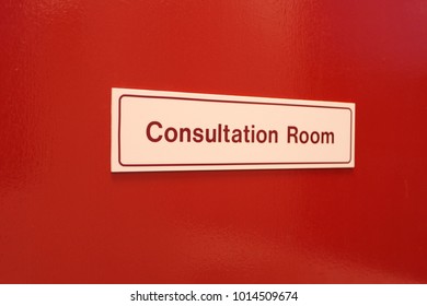 Consultation Room Sign On Red Door