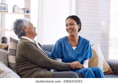 Consulting, caregiver and elderly woman laughing on sofa and holding hands in home living room. Support or healthcare, happy and female nurse talking or communication with senior citizen on a couch - Powered by Shutterstock