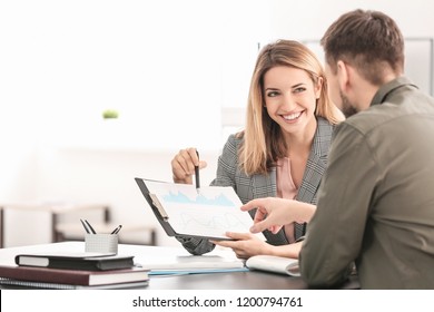 Consulting Manager With Man At Meeting In Office