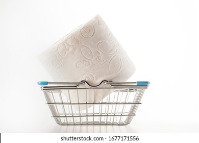 Consumer Buying Panic About Coronavirus Covid-19 Concept. Toilet Paper Roll In Shopping Cart Isolated. People Are Stocking Up Essentials For Home Quarantine