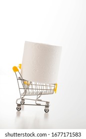 Consumer Buying Panic About Coronavirus Covid-19 Concept. Toilet Paper Roll In Shopping Trolley Isolated. People Are Stocking Up Essentials For Home Quarantine