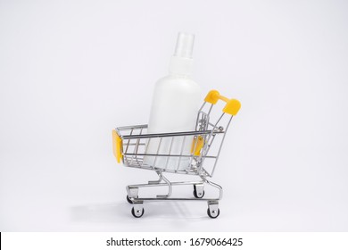 Consumer Buying Panic About Coronavirus Covid-19 Concept. Sanitizer Antiseptic Gel In Shopping Trolley Isolated. People Are Stocking Up Essentials For Home Quarantine.