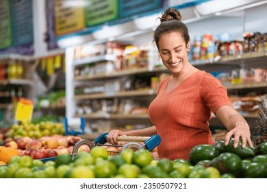 Consumer evaluates quality of avocado in supermarket - Powered by Shutterstock