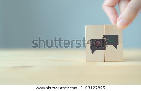 Consumer feedback concept.  Customer satisfaction evaluation to improve and develop product and service. Customer centric.  Hand put wooden cubes with 