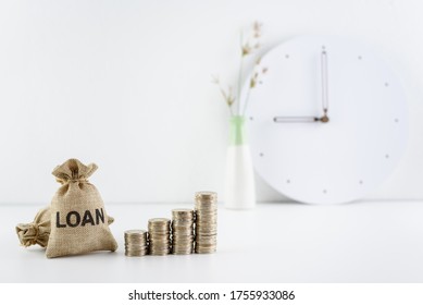 Consumer Loan Refinance, Financial Concept : Loan Bags, Row Of Rising Coins On A Table, Depicts Business Or Debtor Revises Interest Rate, Repayment Period Or Credit Agreement To Save On Debt Payment.