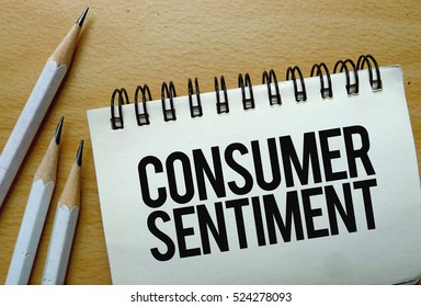 Consumer Sentiment text written on a notebook with pencils - Shutterstock ID 524278093