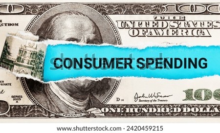 Consumer Spending. The word Consumer Spending in the background of the US dollar. Consumerism, Retail, and Economic Consumption Concept.