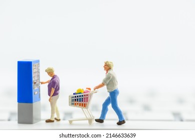 Consumer uses the display interface on a vending machine or modern kiosk to select types and quantity of products e.g tickets and chooses payment method of either cash, credit or debit card, smartcard - Shutterstock ID 2146633639