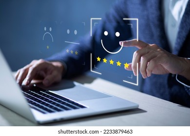 Consumers are evaluating their satisfaction with the service. Consumers write reviews about their satisfaction with a product or service. Consumers use the smiley face icon symbol and 5 stars. - Shutterstock ID 2233879463